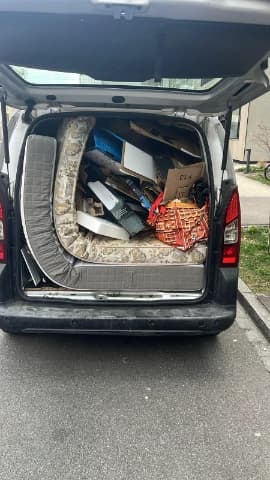 Mattress disposal service collecting a used mattress